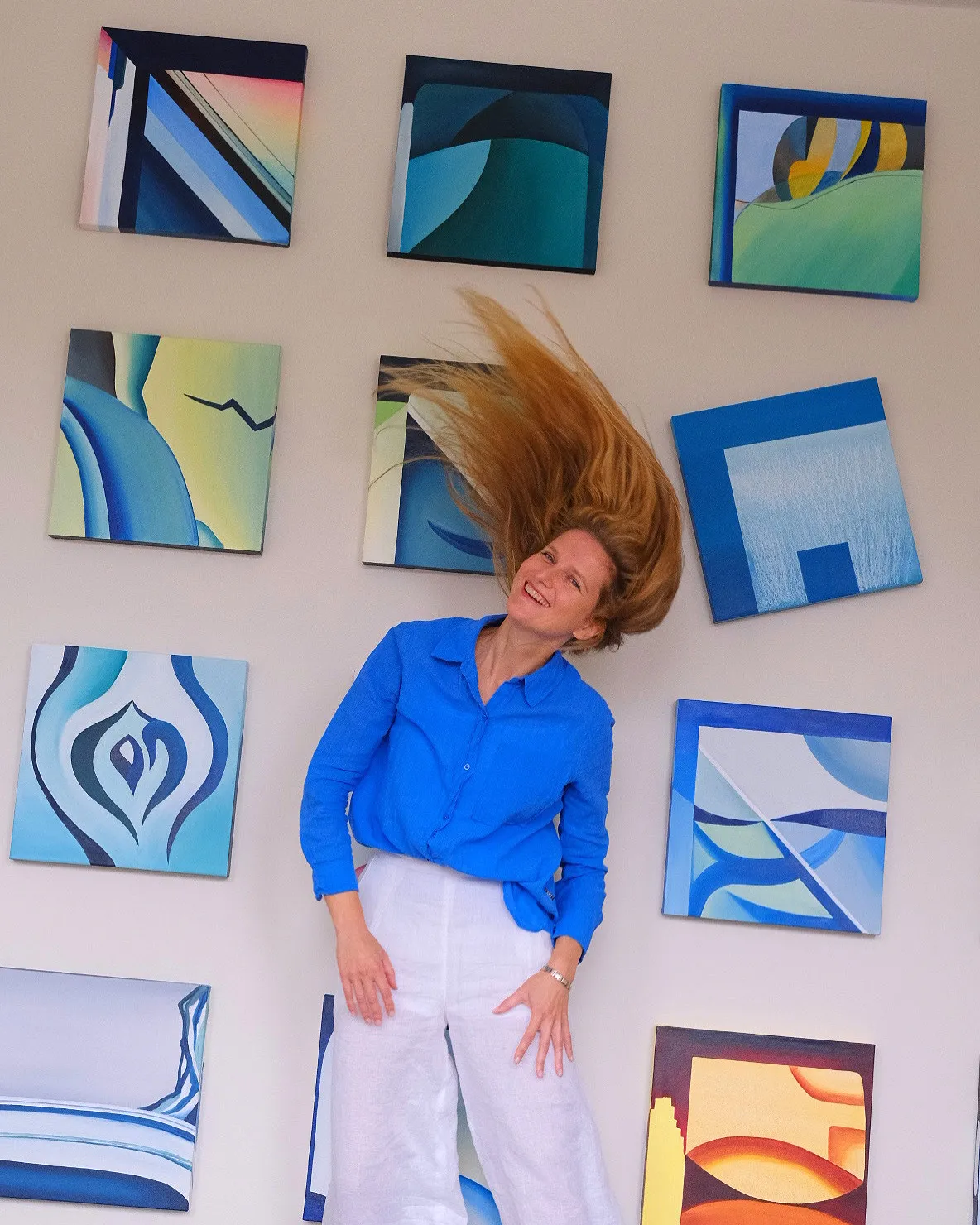 Alexandra Arshanskaya with the Intertwined Realities paintings